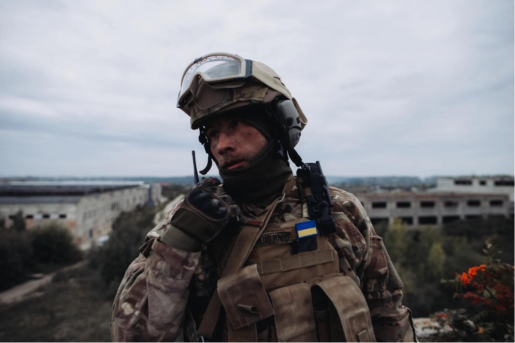 Soldier communicating on a walkie-talkie