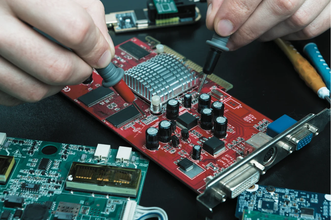 Engineer measuring on a power electronics circuit board